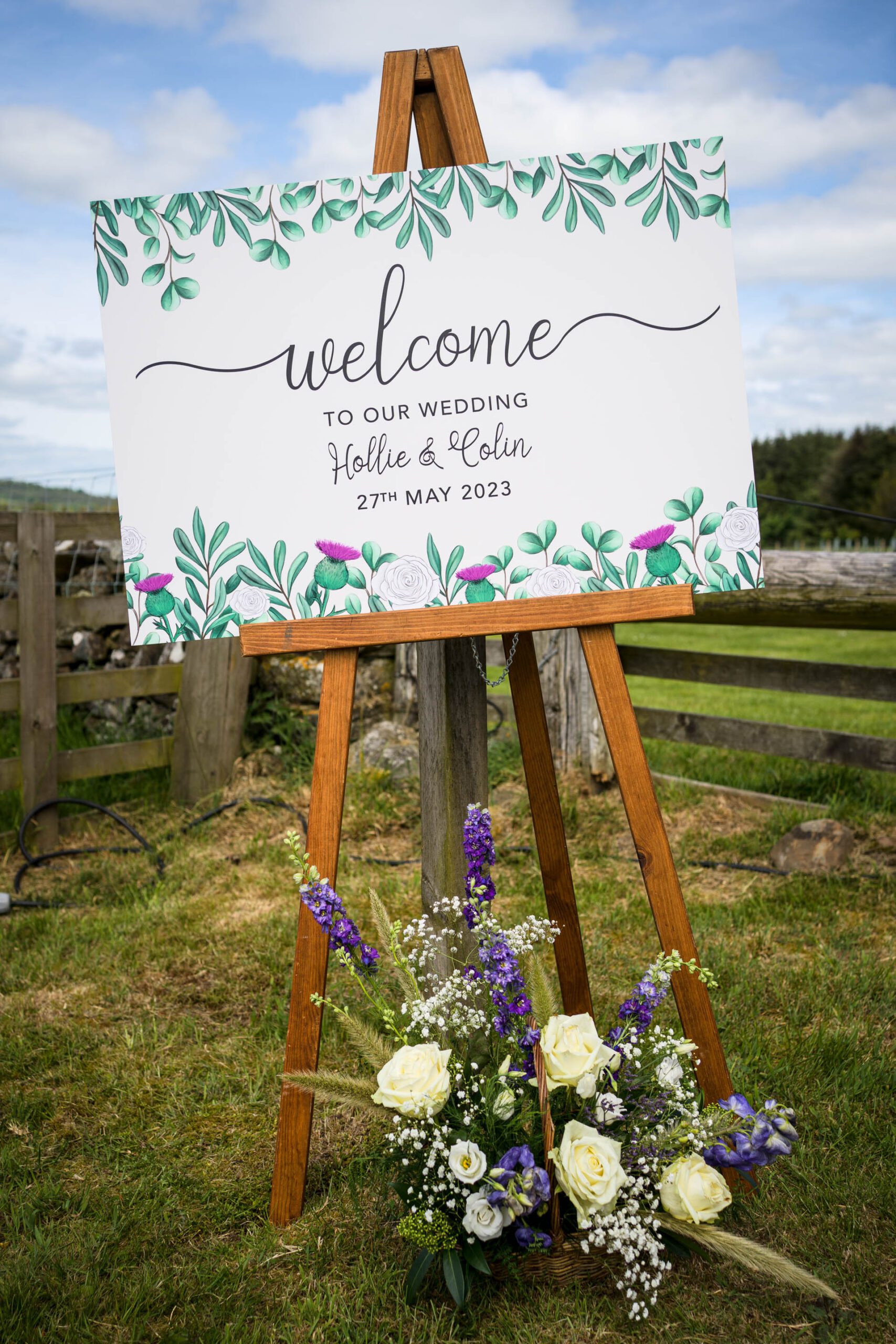 Welcome sign and flowers at the entrance to Hollie and Colin's Scottish Borders Wedding