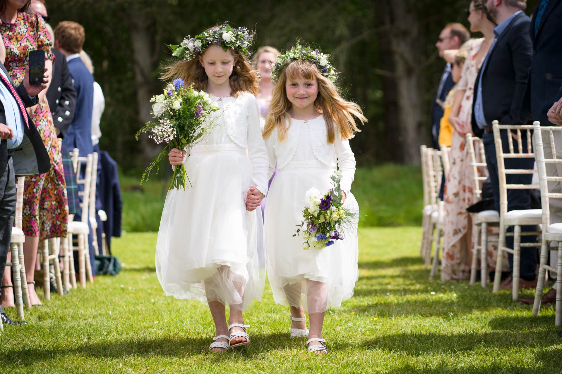 Flower girls walking up the aisle