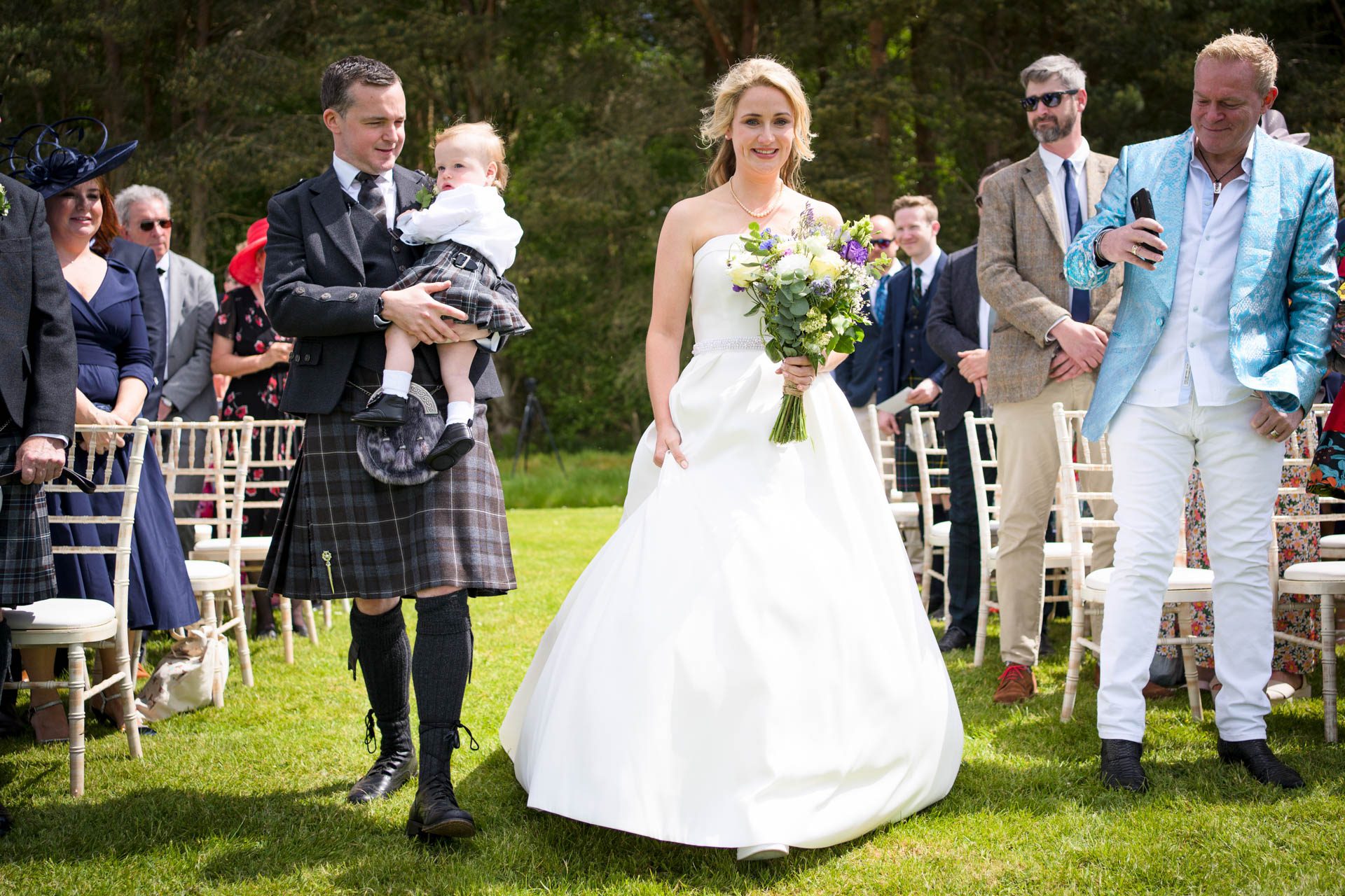 the bride and groom walking up the aisle