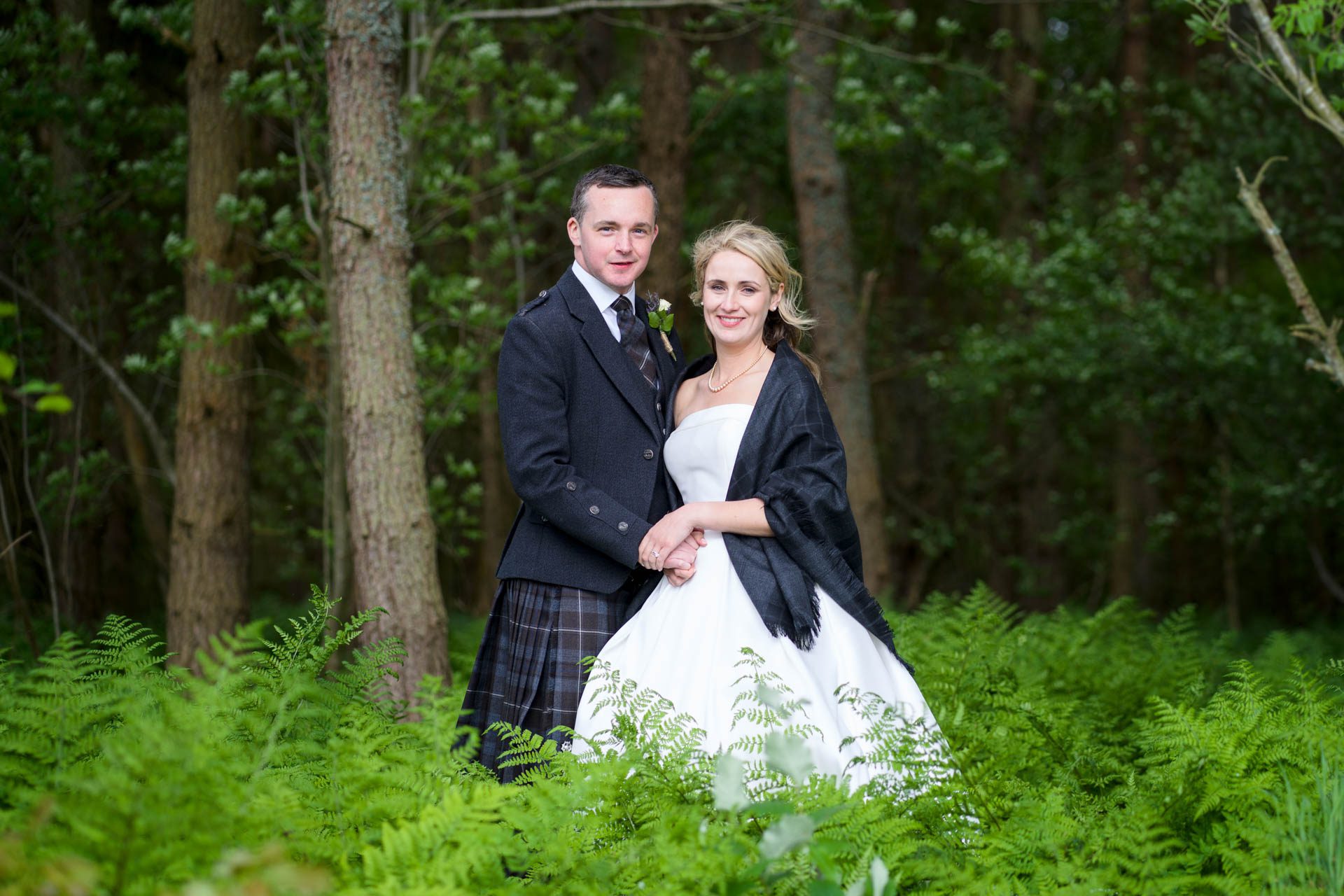 Wedding portrait of Hollie and Colin in the woods at their Scottish Borders wedding