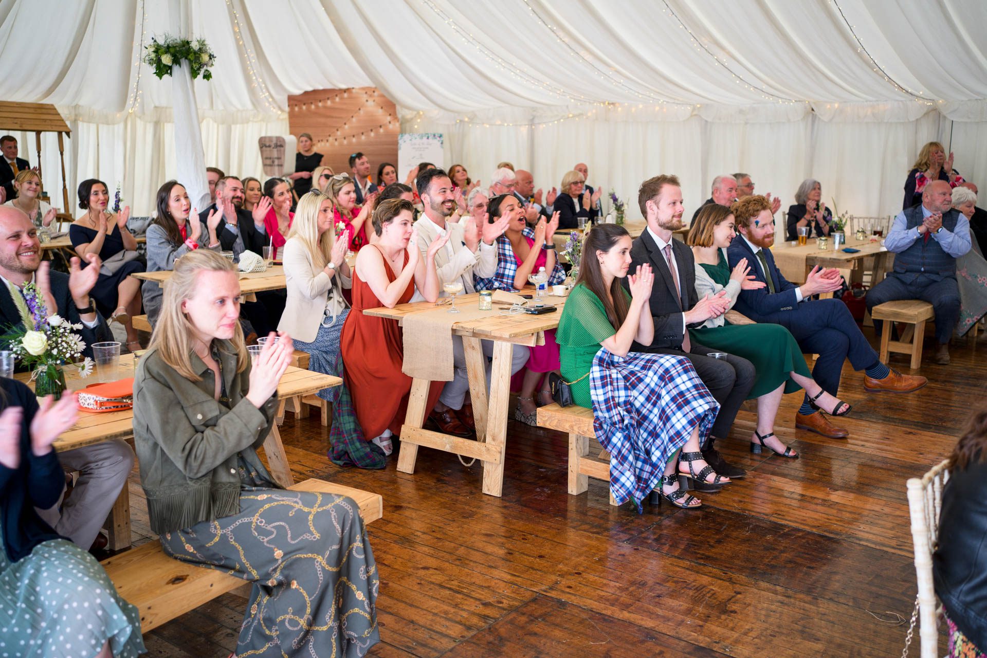 Guests applauding best man's speech