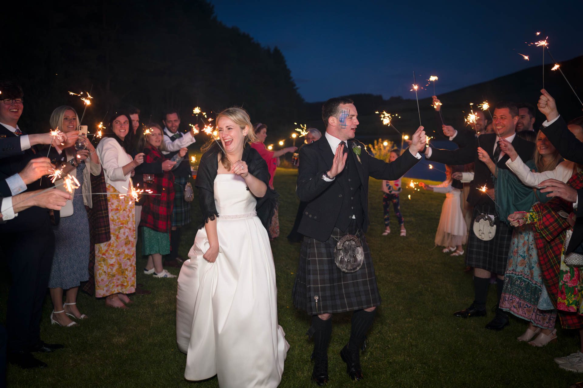 Sparklers for bride, groom and guests after the sun has gone down