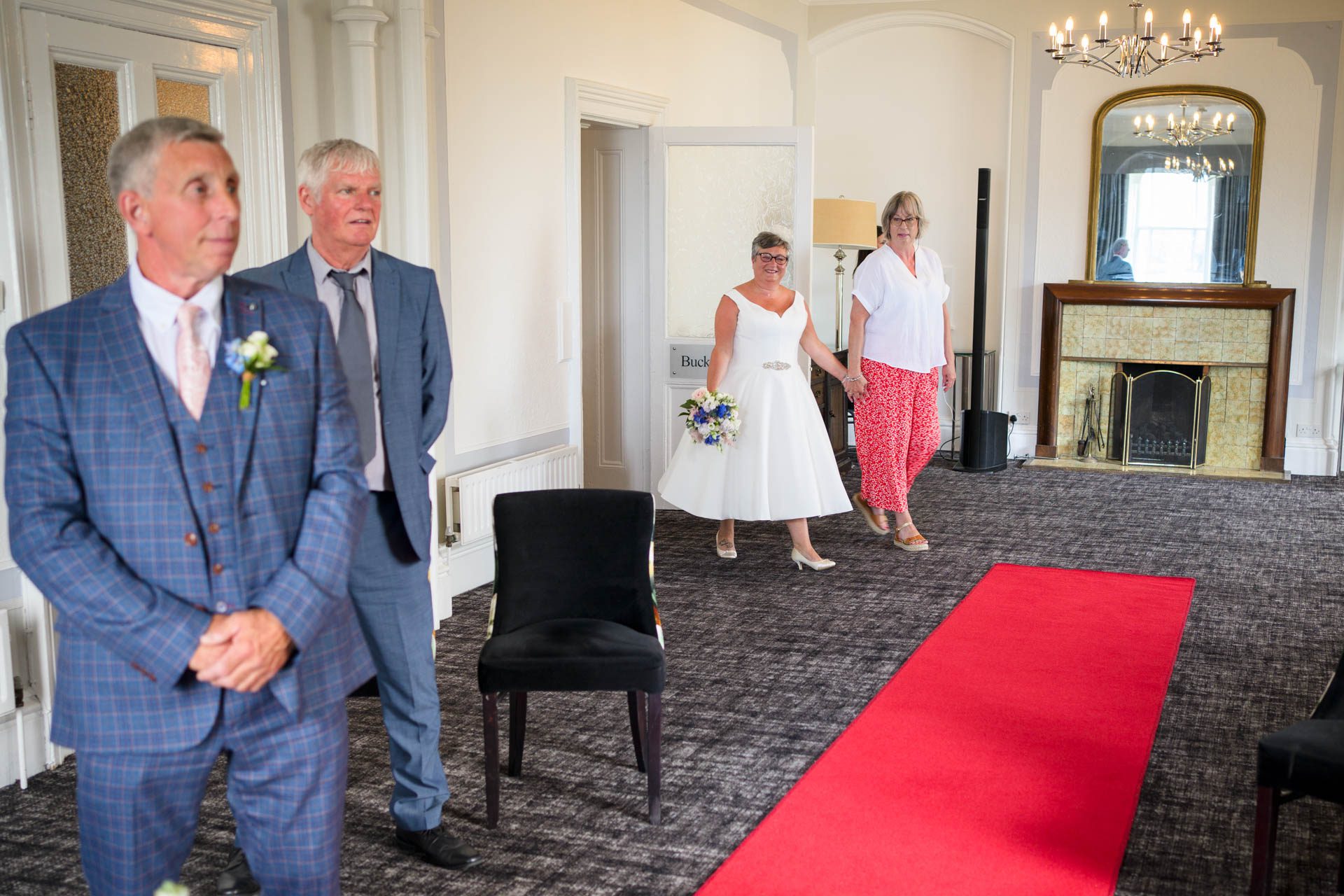 Carol arriving in the ceremony room for her Low Wood Bay Resort Wedding