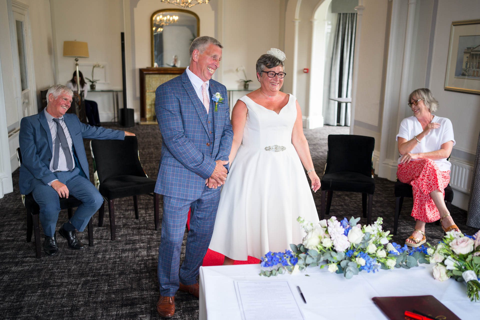 Bride, groom and guests laughing during Low Wood Bay Resort Wedding ceremony