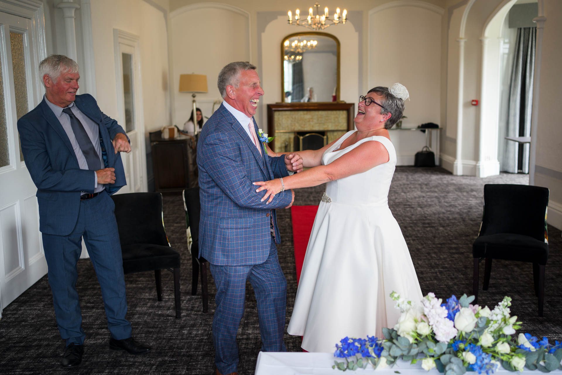 More laughter from the bride and groom during a Low Wood Bay Resort Wedding ceremony