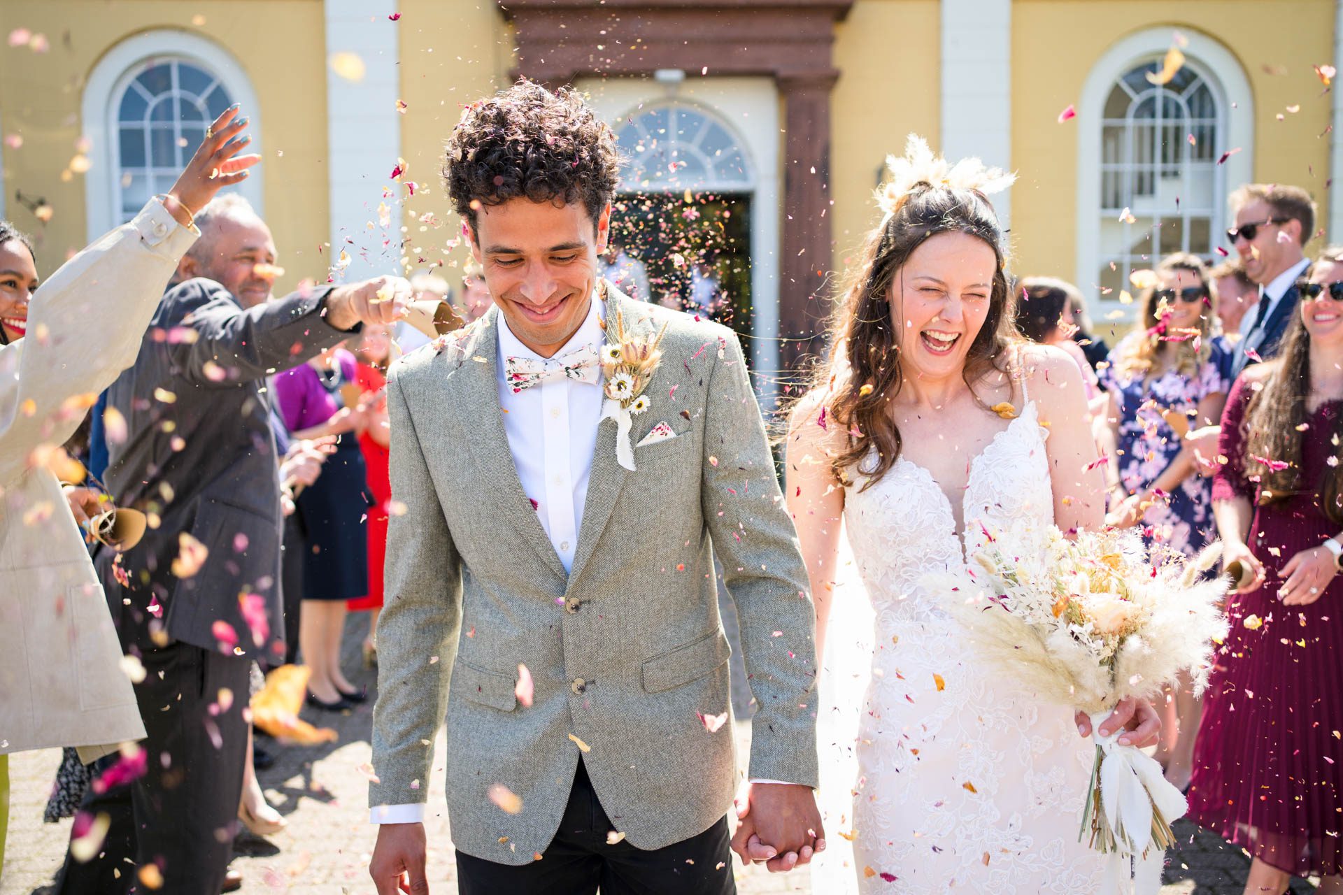 Cockermouth Town Hall Wedding - confetti being thrown at the bride and groom